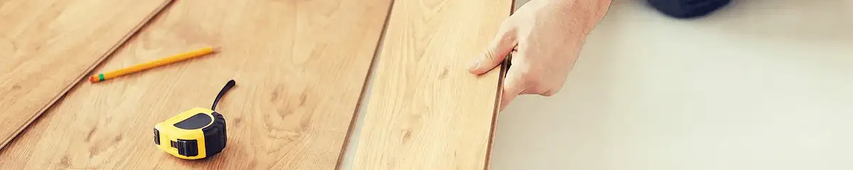 A professional installing wood flooring in Philadelphia, PA