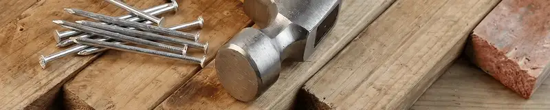 Hammer and nails on hardwood flooring boards in Philadelphia, PA