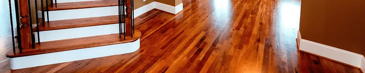 Base floor of a staircase with professionally restored wood flooring in Philadelphia PA