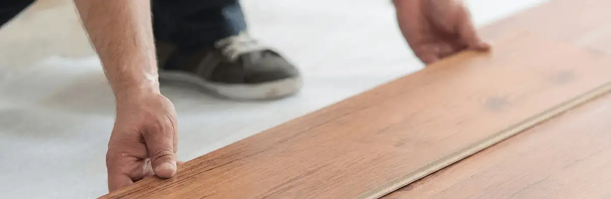 A professional installing laminate flooring in Philadelphia, PA