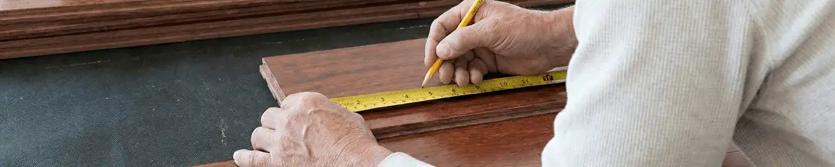 A professional installing wood flooring in Philadelphia, PA